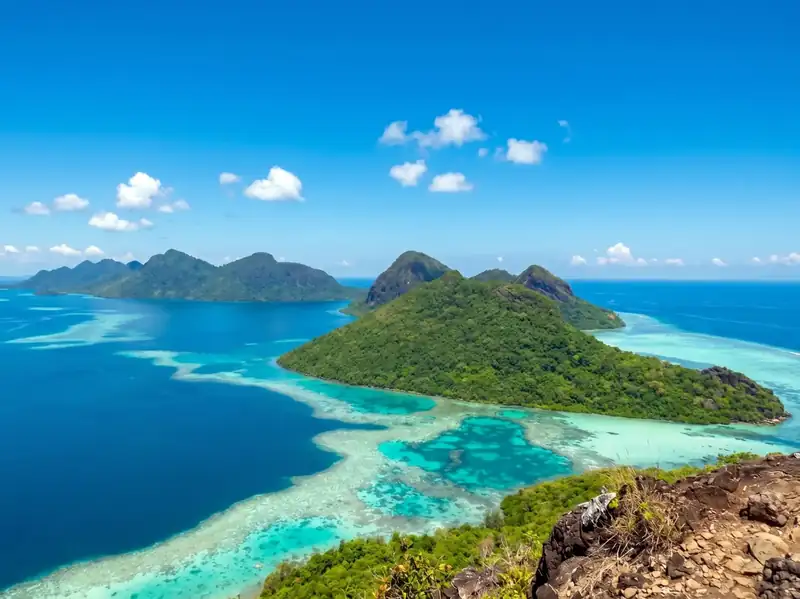 Hiking Bohey Dulang peak for panoramic lagoon views with WB Shun Shun Water Bungalows