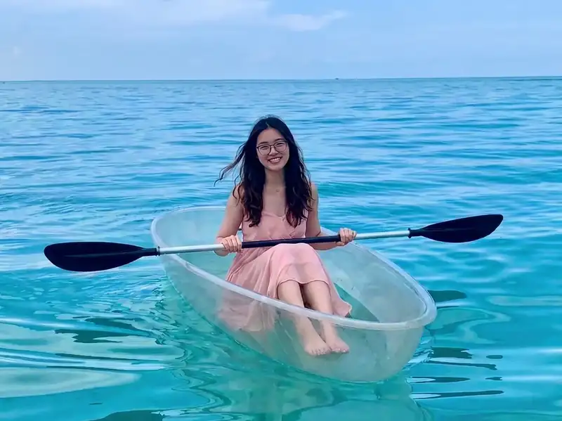 Enjoying a transparent kayak ride through crystal clear waters near WB Shun Shun Water Bungalows