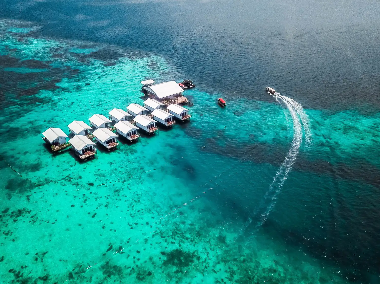 WB Shun Shun Water Bungalows overwater bungalows at sunrise over Semporna